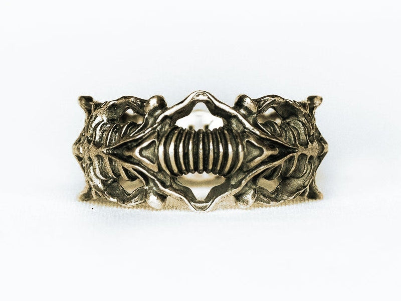 BIOORGA ring front view on white, digitally recoloured brass preview preserving the original sculpted design.